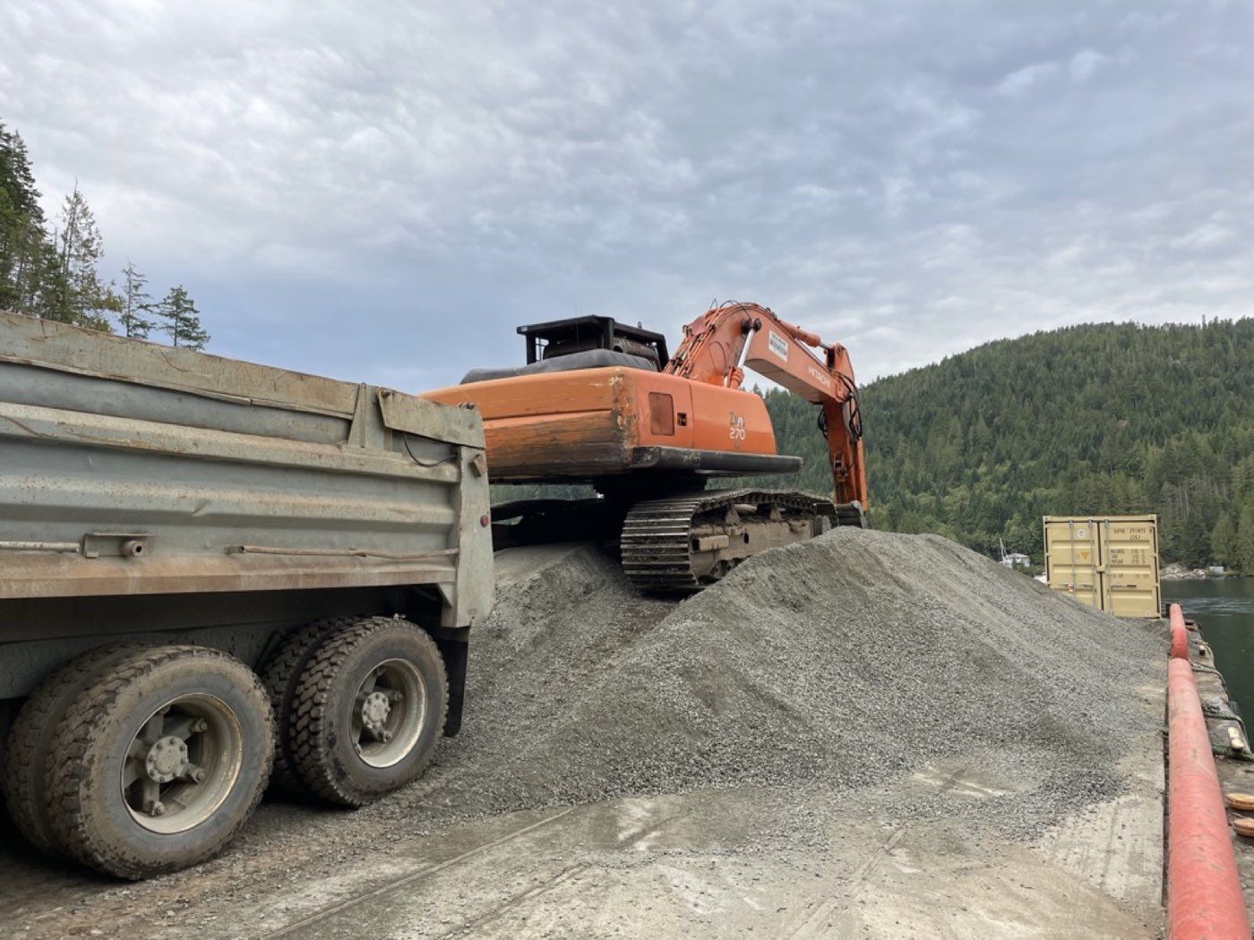 Tandem dump truck delivering road base gravel for a Quadra Island driveway